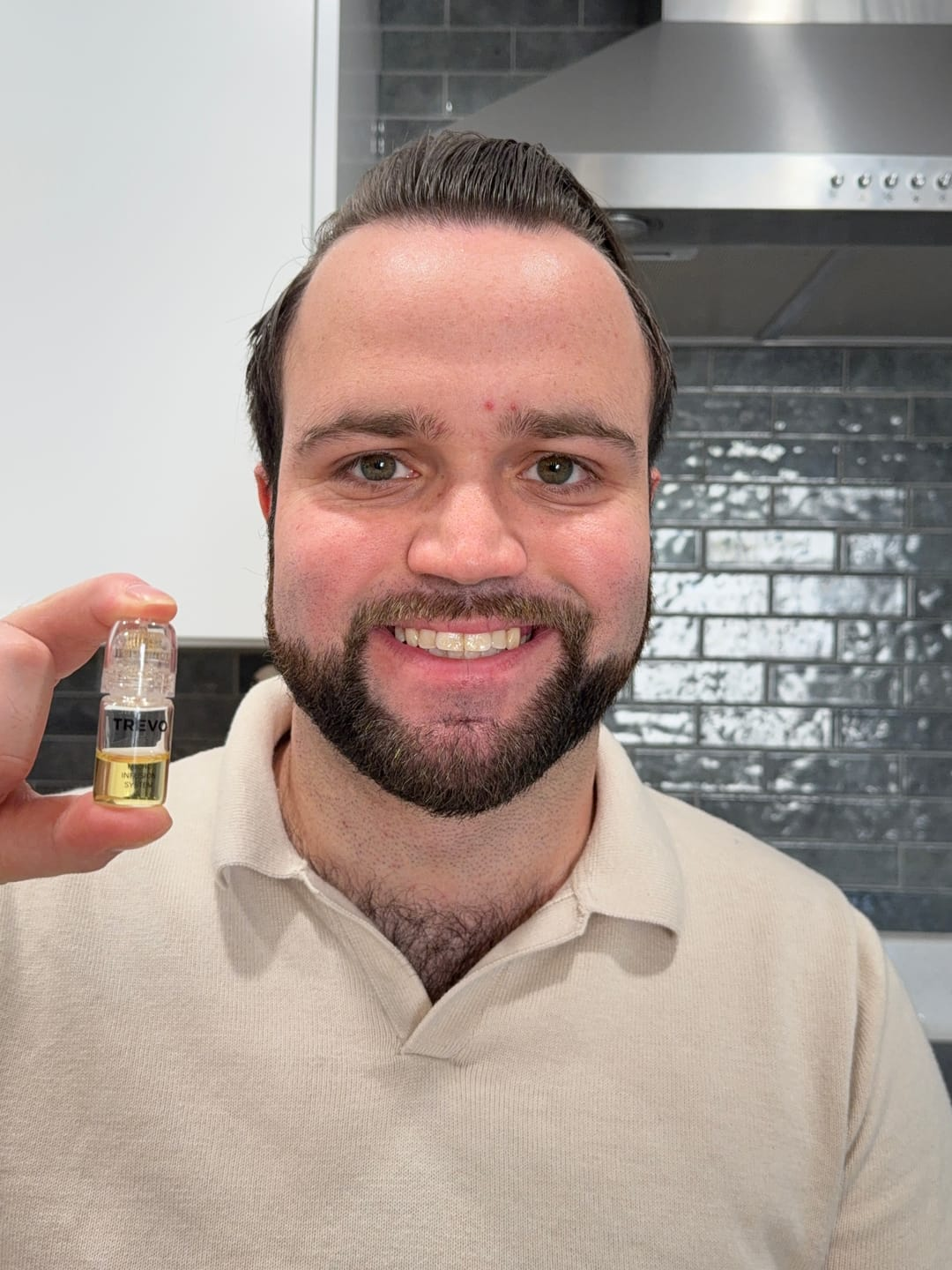 Customer photo — holding the TREVO Infuse device